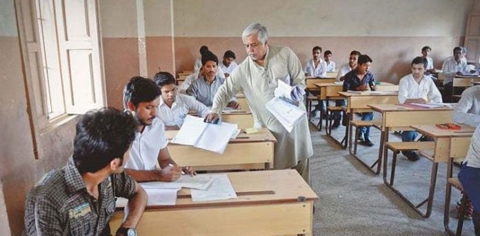 image of students giving exams to show as featured image of "The KP Board has announced the Intermediate results, with girls scoring higher than boys